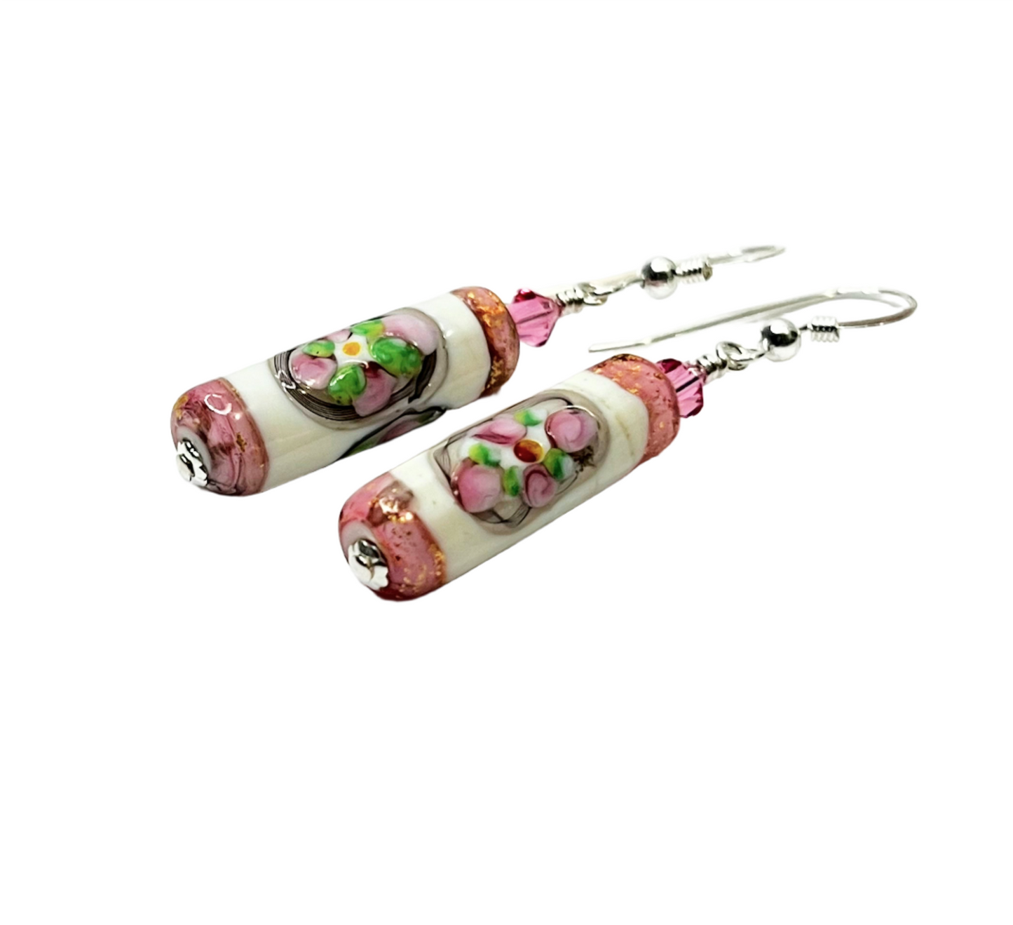 a pair of earrings with pink and white beads