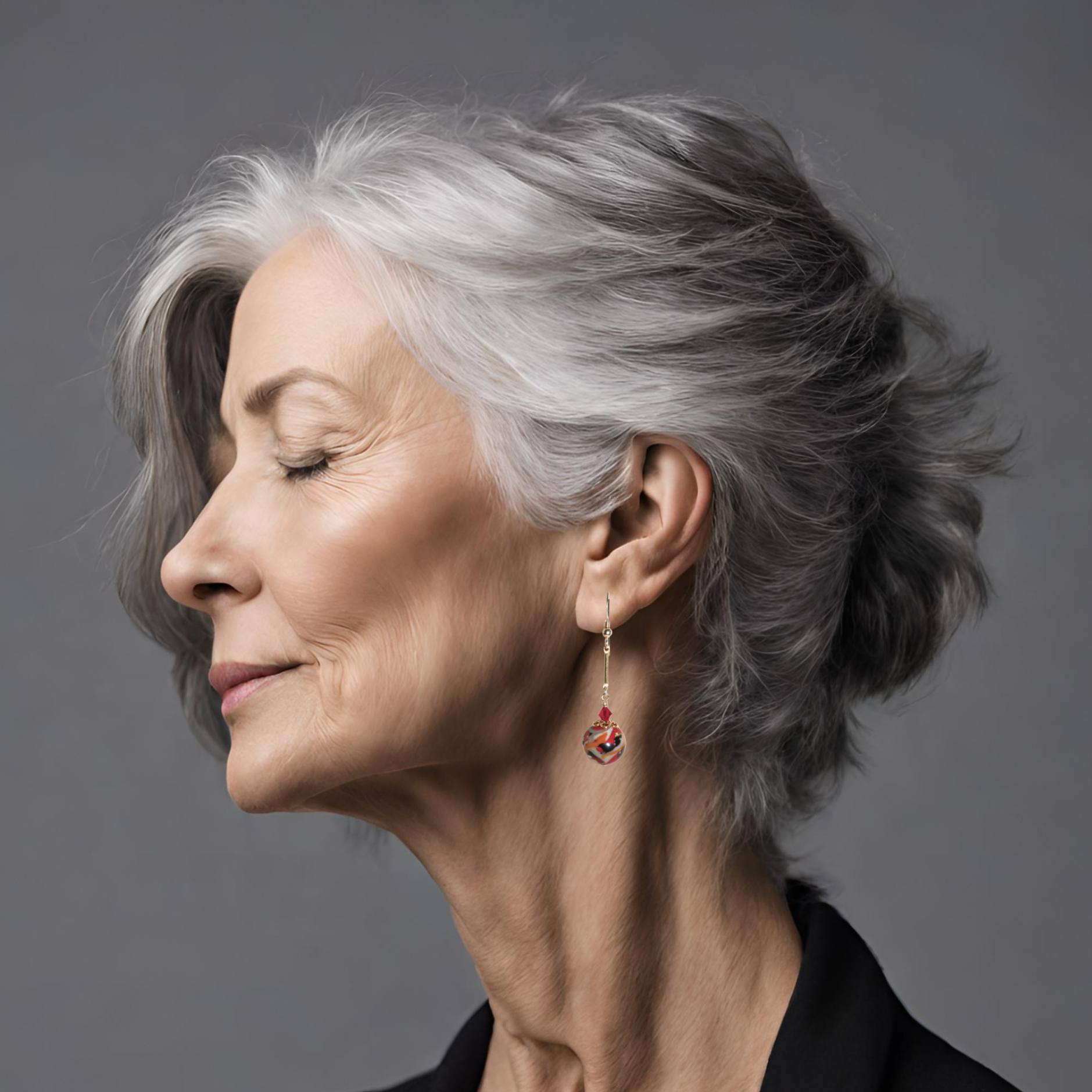 an older woman with gray hair and earrings