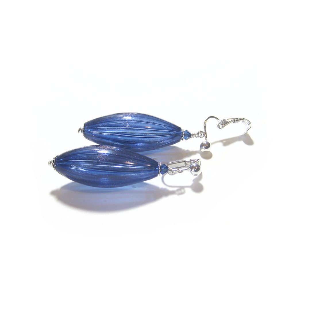 a pair of blue glass earrings on a white background