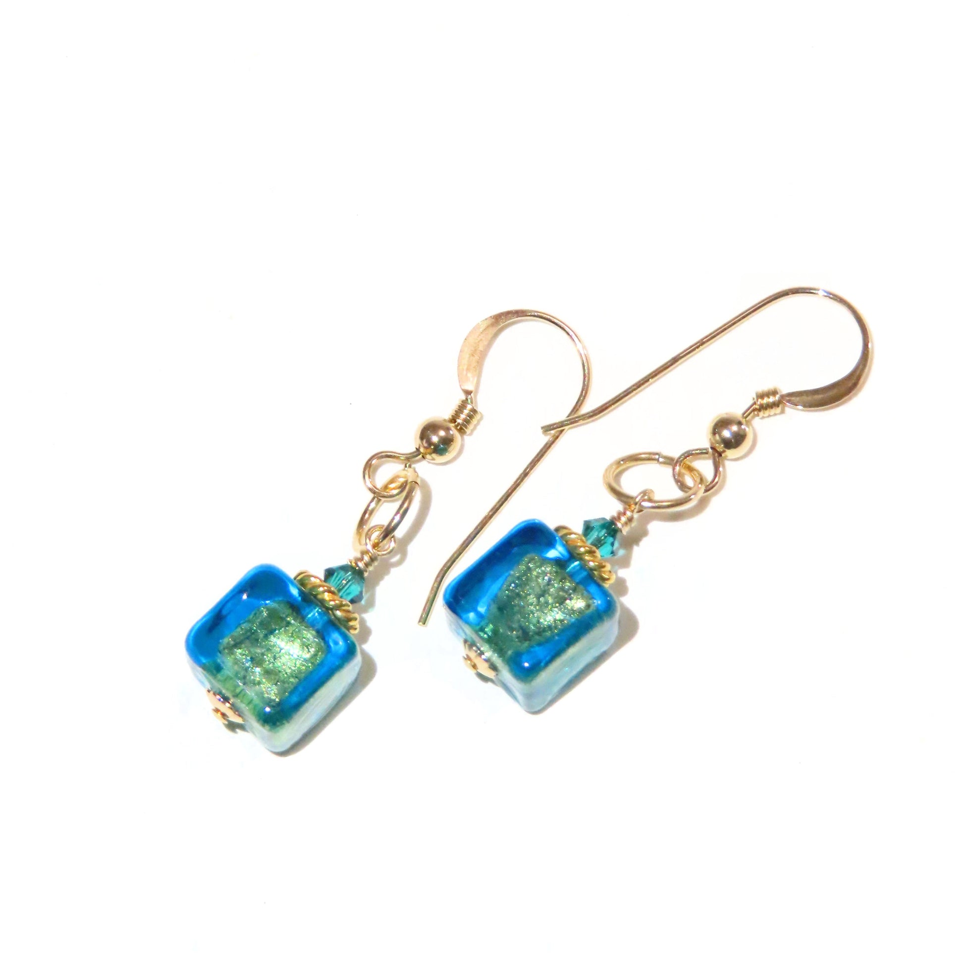 a pair of blue and green glass earrings