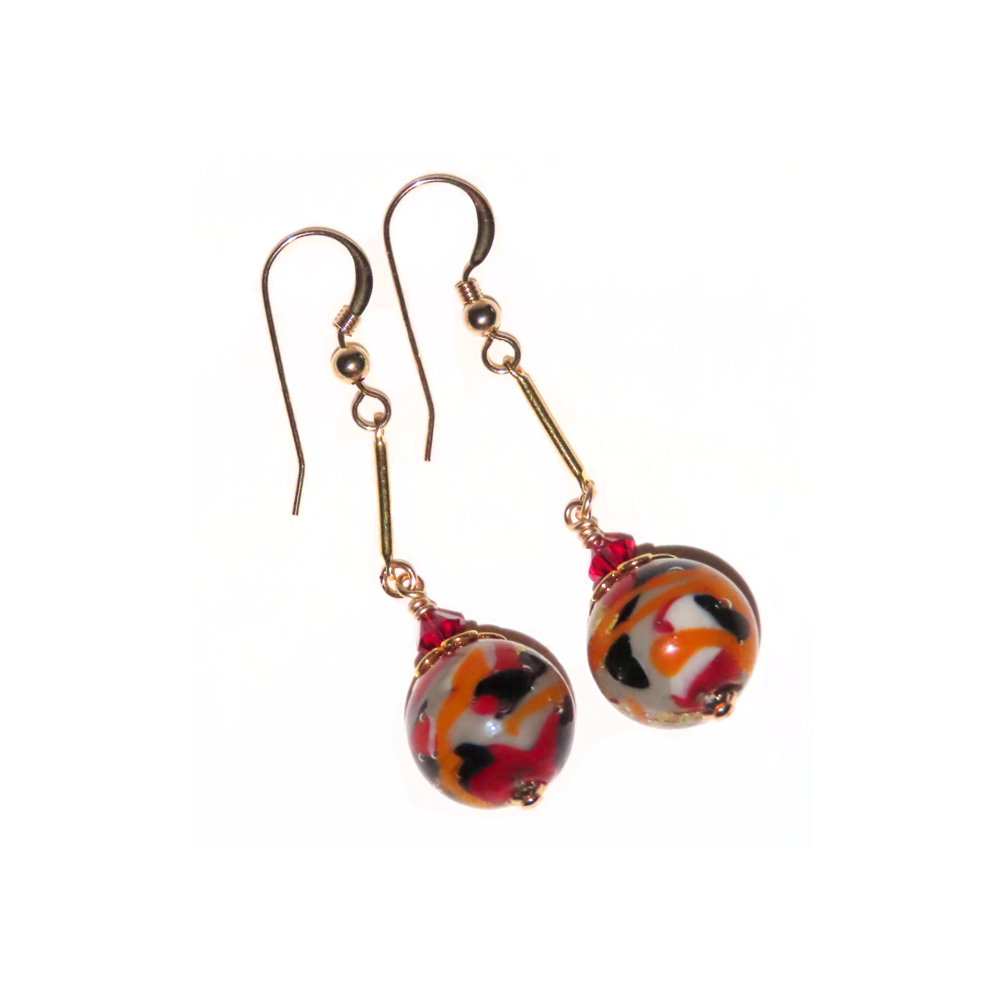 a pair of earrings with red and black beads