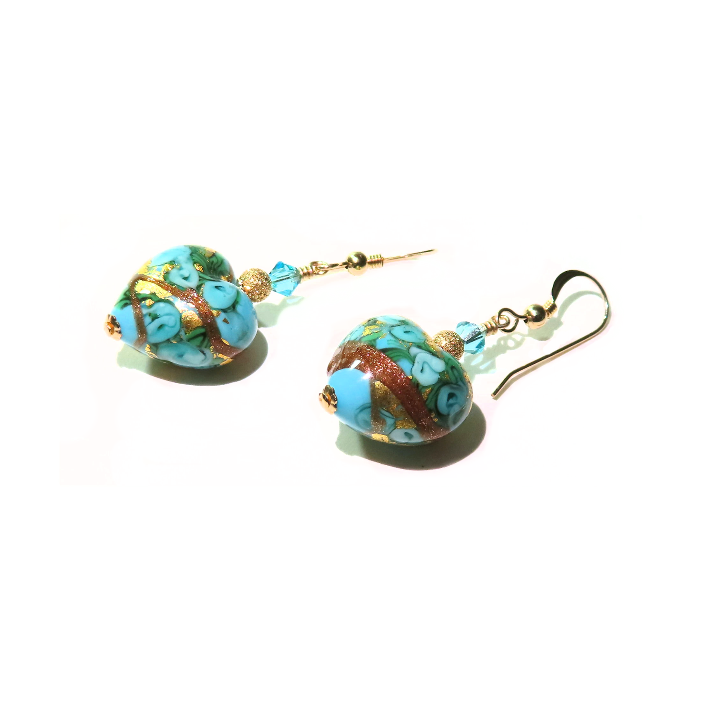 a pair of earrings with turquoise heart beads